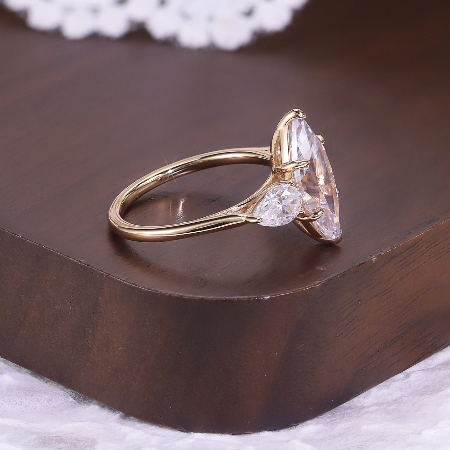 Marquise cut moissanite three-stone engagement ring with pear-shaped side stones in 18K gold plated S925 sterling silver
