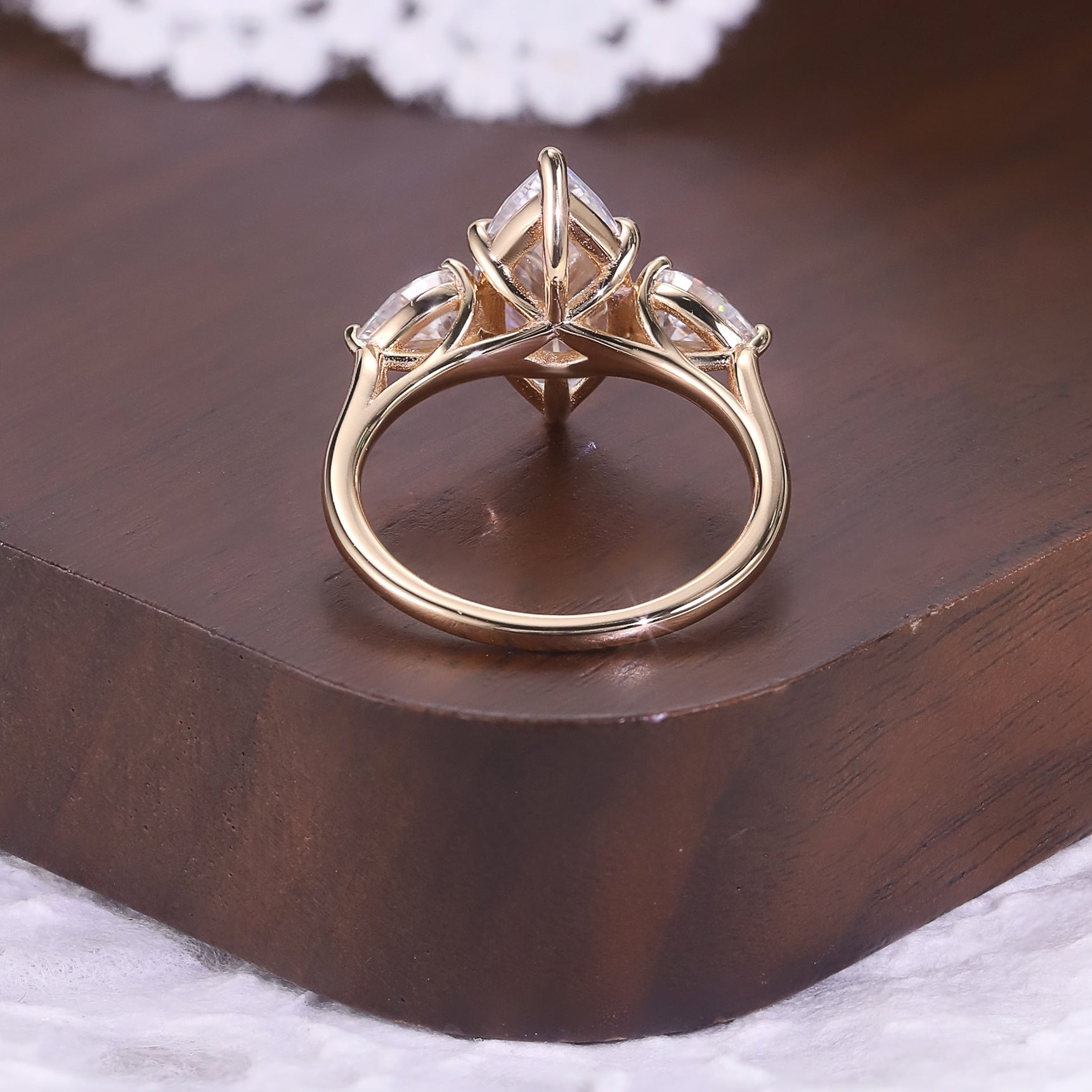 Marquise cut moissanite three-stone engagement ring with pear-shaped side stones in 18K gold plated S925 sterling silver