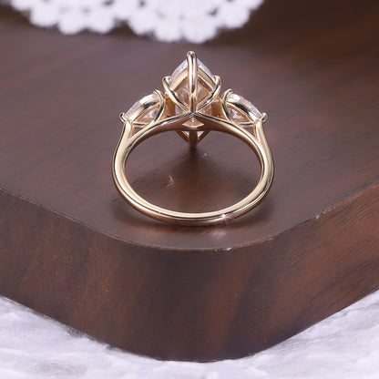 Marquise cut moissanite three-stone engagement ring with pear-shaped side stones in 18K gold plated S925 sterling silver