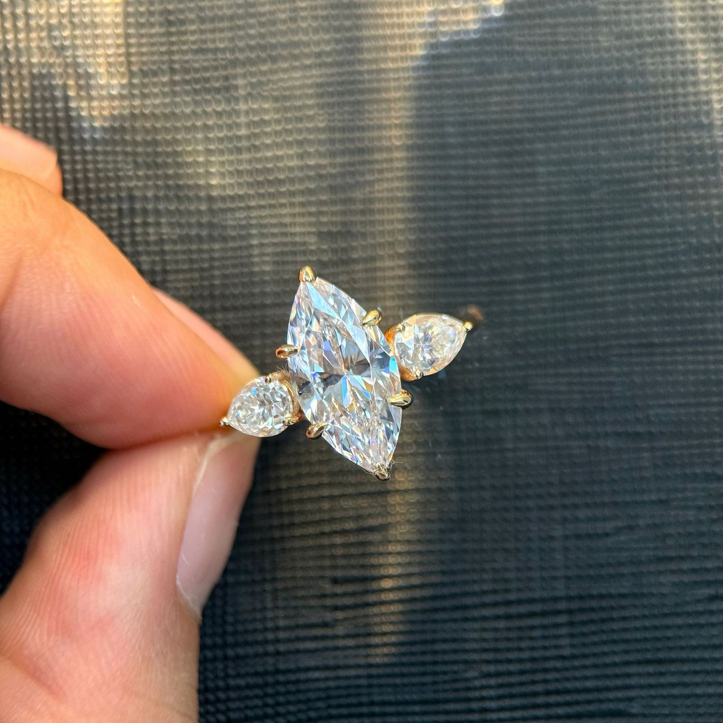 Marquise cut moissanite three-stone engagement ring with pear-shaped side stones in 18K gold plated S925 sterling silver