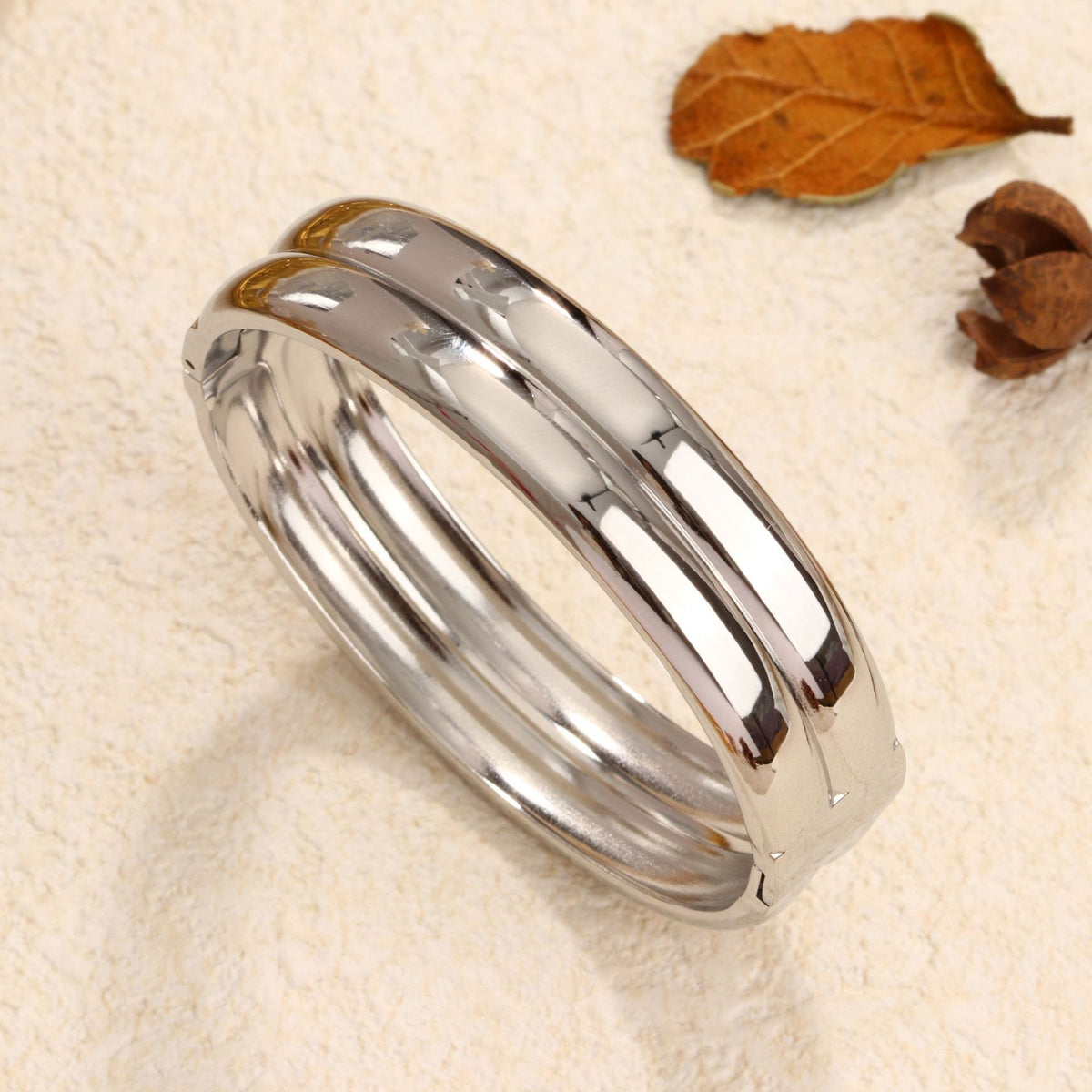 Minimalist double-layer polished band hinged cuff bangle in waterproof 18k gold plated stainless steel jewelry.