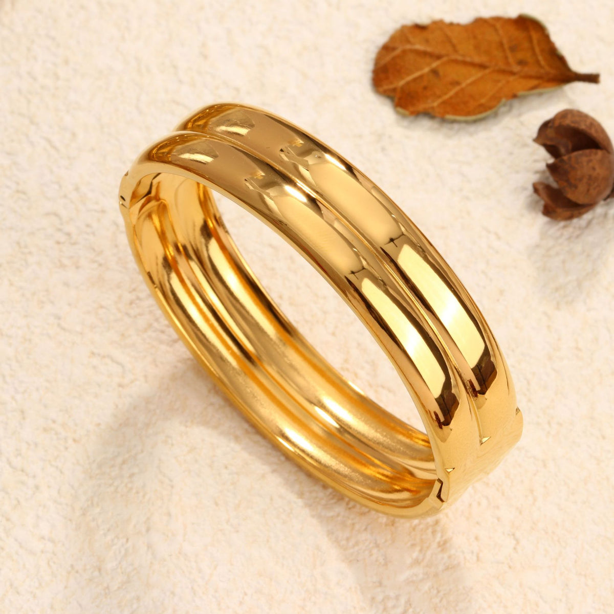 Minimalist double-layer polished band hinged cuff bangle in waterproof 18k gold plated stainless steel jewelry.