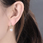 Minimalist S925 silver drop earrings with 18K gold plating, sparkling zircon, and a dangling white pearl
