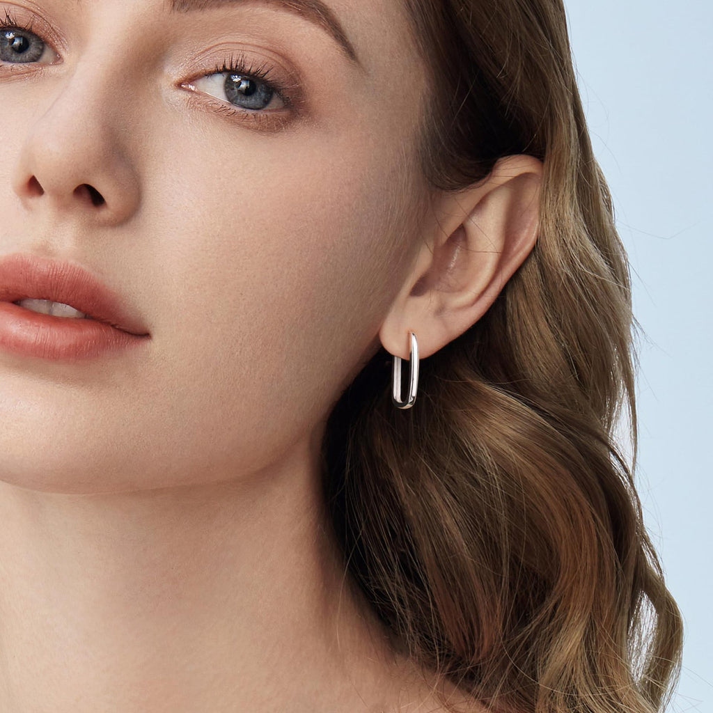 Minimalist S925 silver geometric stud earrings with 18K gold plating. Sleek, modern, and pearl-free design