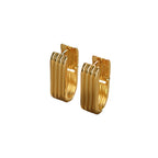 Minimalist vertical striped U-shaped gold huggie hoop earrings with modern ribbed texture