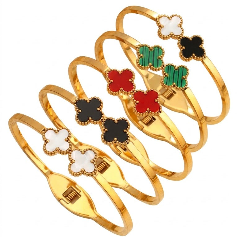 Double four-leaf clover inlay hinged cuff bangle in waterproof 18k gold plated titanium steel jewelry.