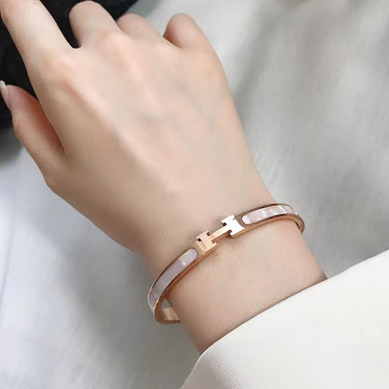 Mother of pearl inlaid H letter buckle hinged cuff bangle in 18k gold plated 316l titanium steel jewelry.