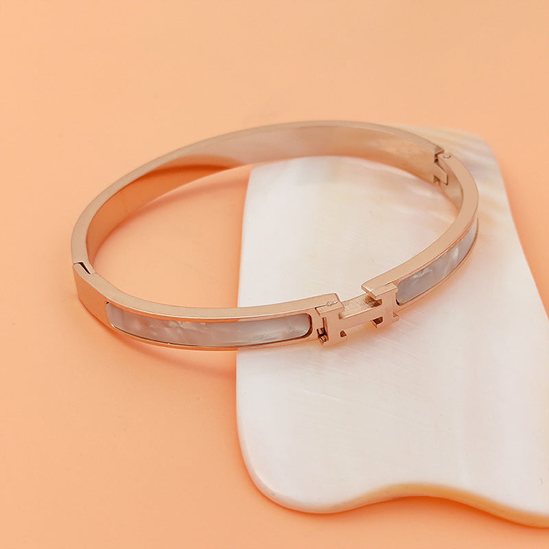 Mother of pearl inlaid H letter buckle hinged cuff bangle in 18k gold plated 316l titanium steel jewelry.
