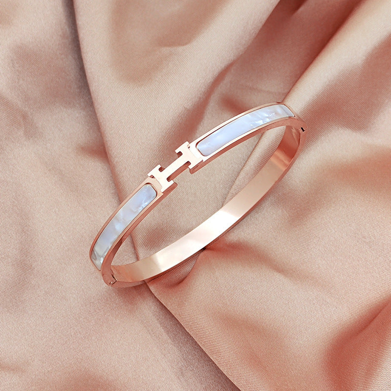 Mother of pearl inlaid H letter buckle hinged cuff bangle in 18k gold plated 316l titanium steel jewelry.