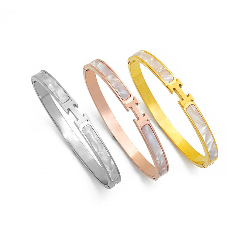 Mother of pearl inlaid H letter buckle hinged cuff bangle in 18k gold plated 316l titanium steel jewelry.