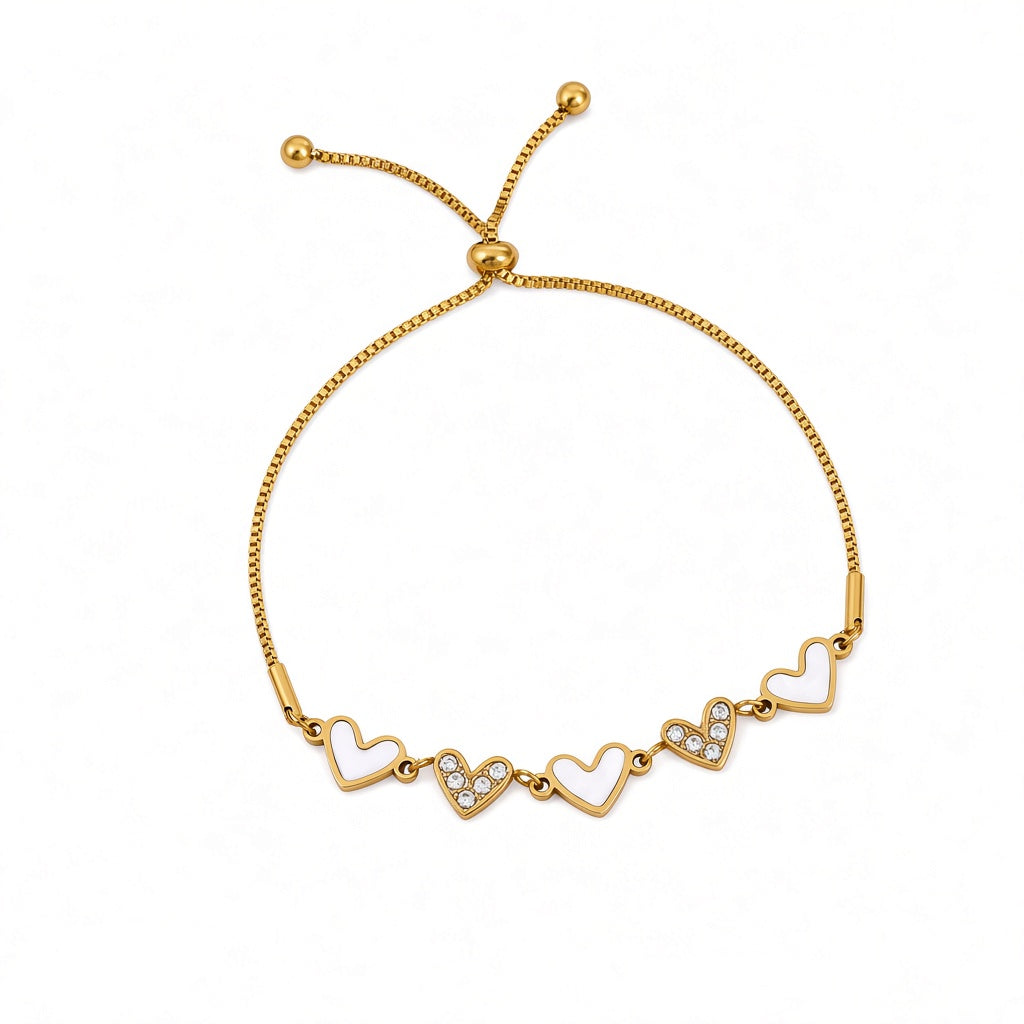 Mother of pearl shell heart stations and pave cubic zirconia CZ heart link slider box chain stainless steel jewelry bracelet in waterproof 18k gold plated finish.
