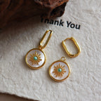 Mother of pearl round disc drop Stainless steel jewelry earrings with gold starburst motif inlaid with turquoise natural stone center