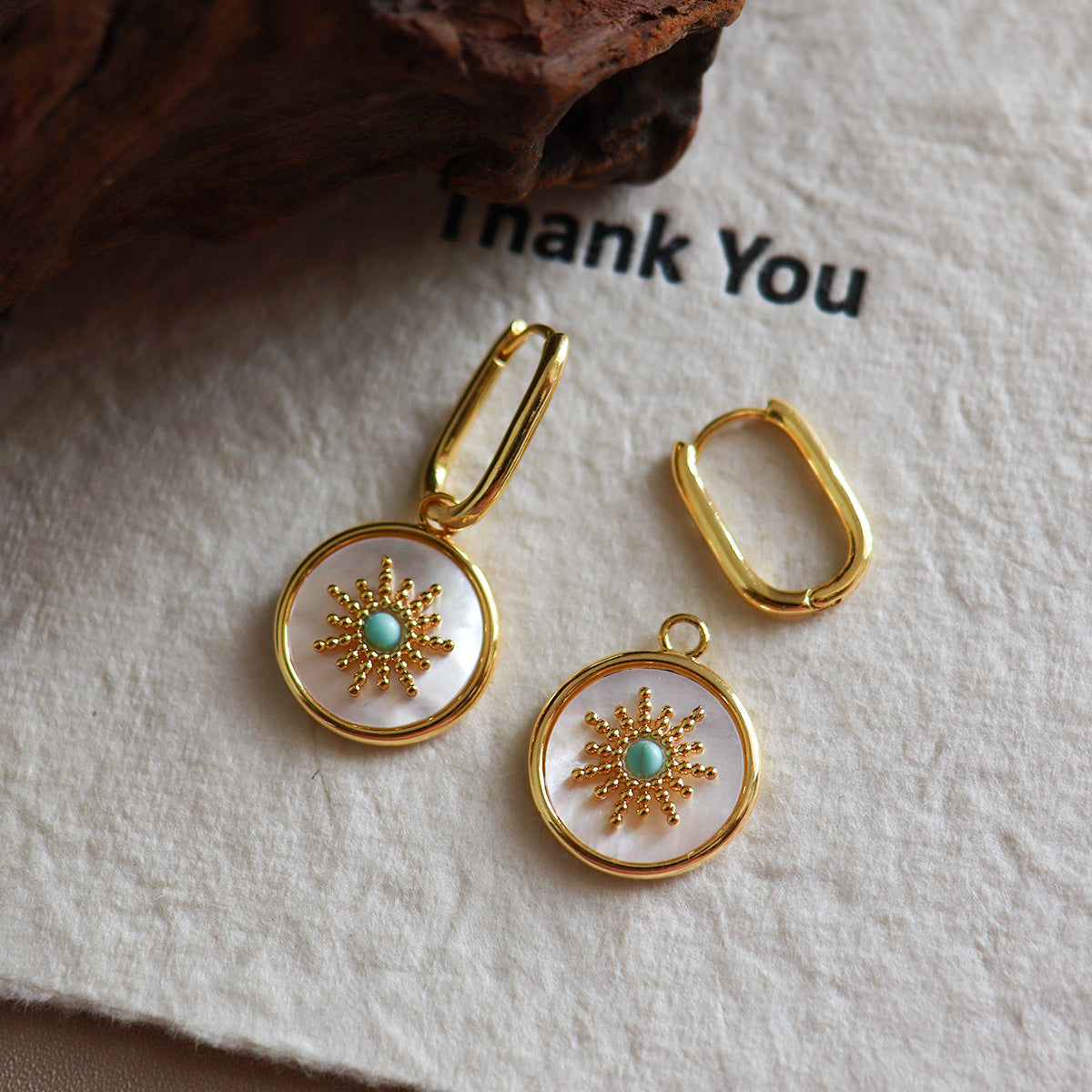 Mother of pearl round disc drop Stainless steel jewelry earrings with gold starburst motif inlaid with turquoise natural stone center
