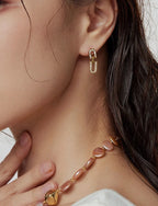 Mother of pearl and sparkling cubic zirconia U-shaped interlocking link stud drop earrings in 18k gold plated jewelry