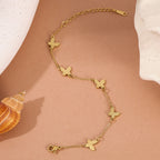 Textured butterfly charm stations fine link chain stainless steel jewelry bracelet in waterproof 18k gold plated finish.