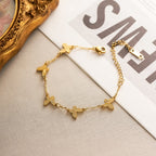 Textured butterfly charm stations fine link chain stainless steel jewelry bracelet in waterproof 18k gold plated finish.