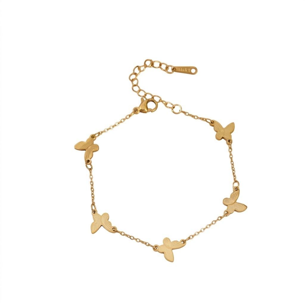 Textured butterfly charm stations fine link chain stainless steel jewelry bracelet in waterproof 18k gold plated finish.