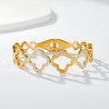 Multi four-leaf clover station and pave cubic zirconia accent stainless steel jewelry bangle in waterproof 18k gold plated finish.
