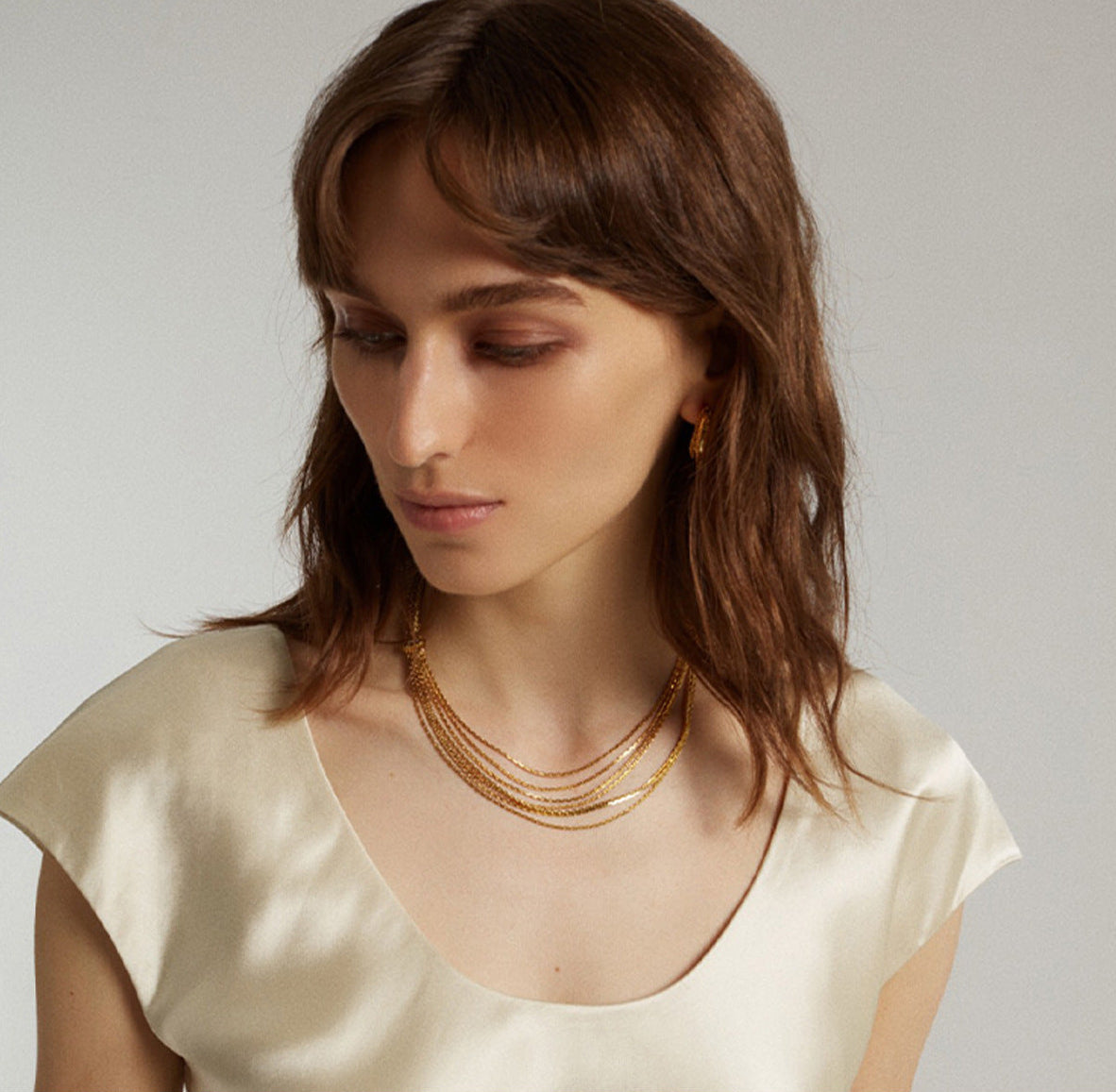 Multi-strand layered waterfall chain necklace with fluid gold sliding accent in 18k gold plated jewelry