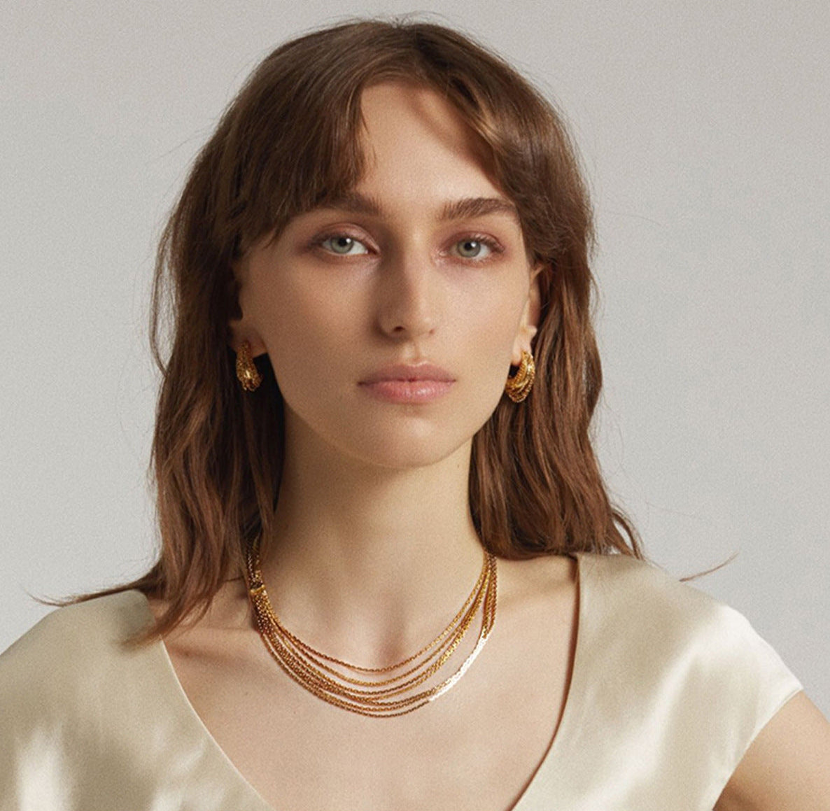 Multi-strand layered waterfall chain necklace with fluid gold sliding accent in 18k gold plated jewelry