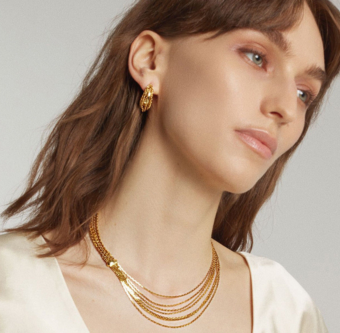 Multi-strand layered waterfall chain necklace with fluid gold sliding accent in 18k gold plated jewelry