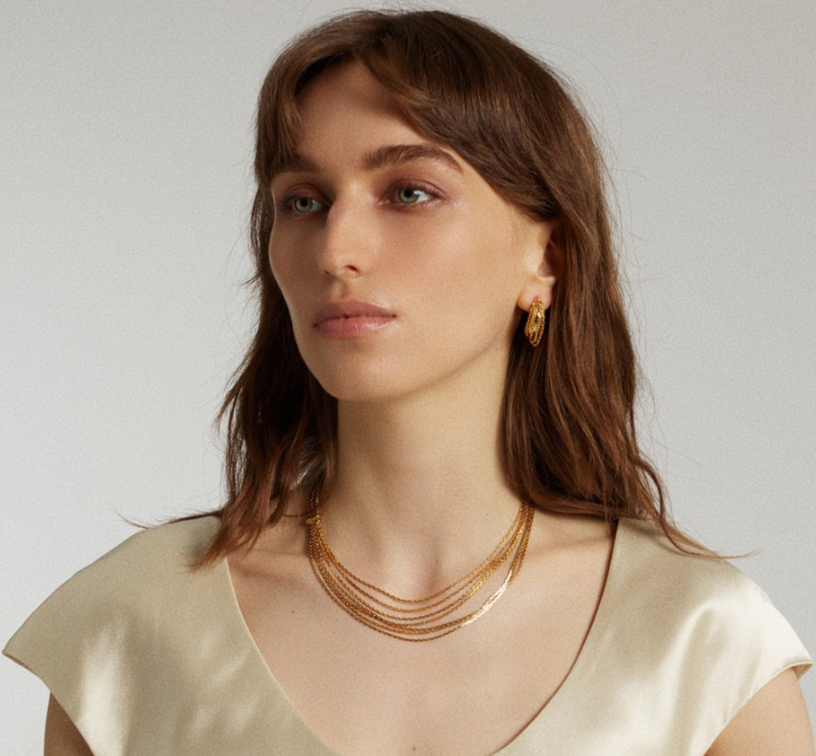 Multi-strand layered waterfall chain necklace with fluid gold sliding accent in 18k gold plated jewelry