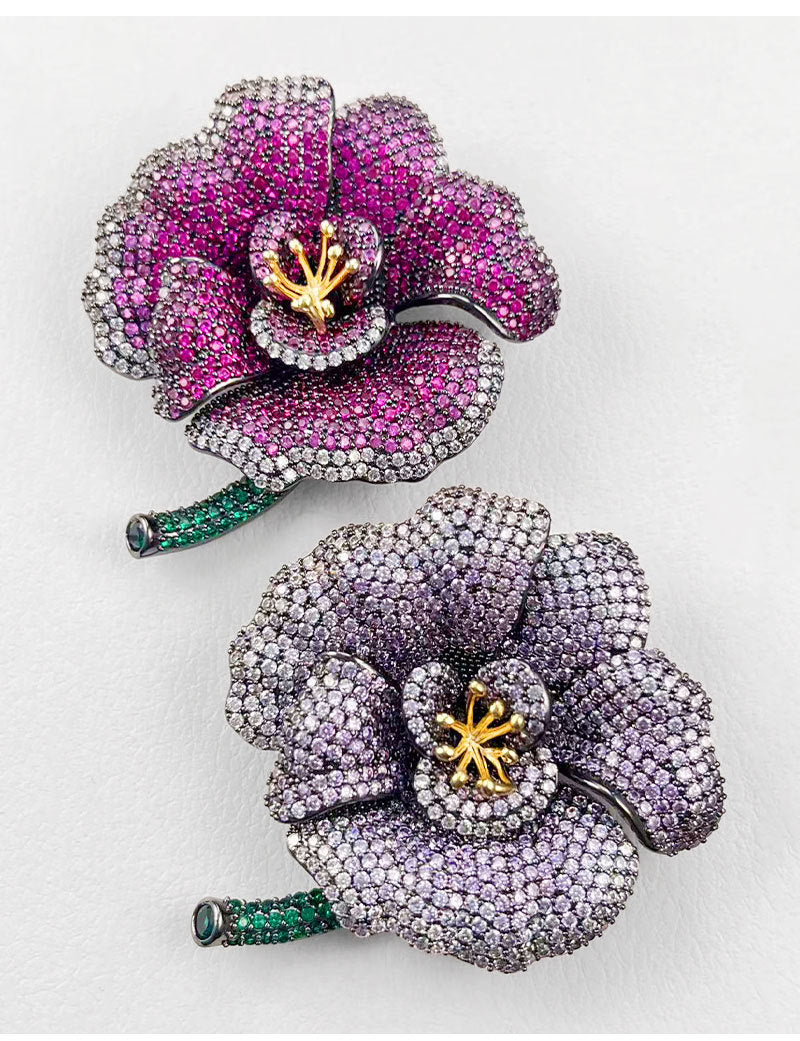 Elegant camellia brooch with purple gradient cubic zirconia petals, a golden stamen, and a green stem