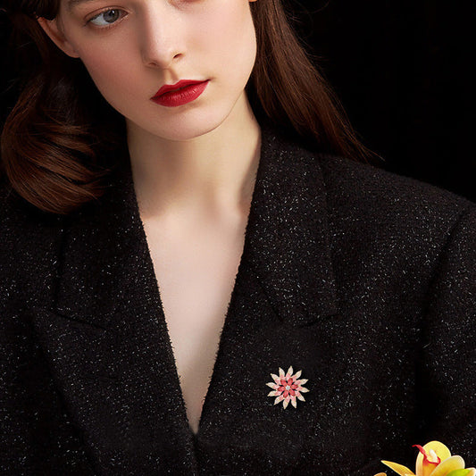 Sparkling rotating sunflower brooch featuring pink gradient marquise cubic zirconia stones in 18K gold plating
