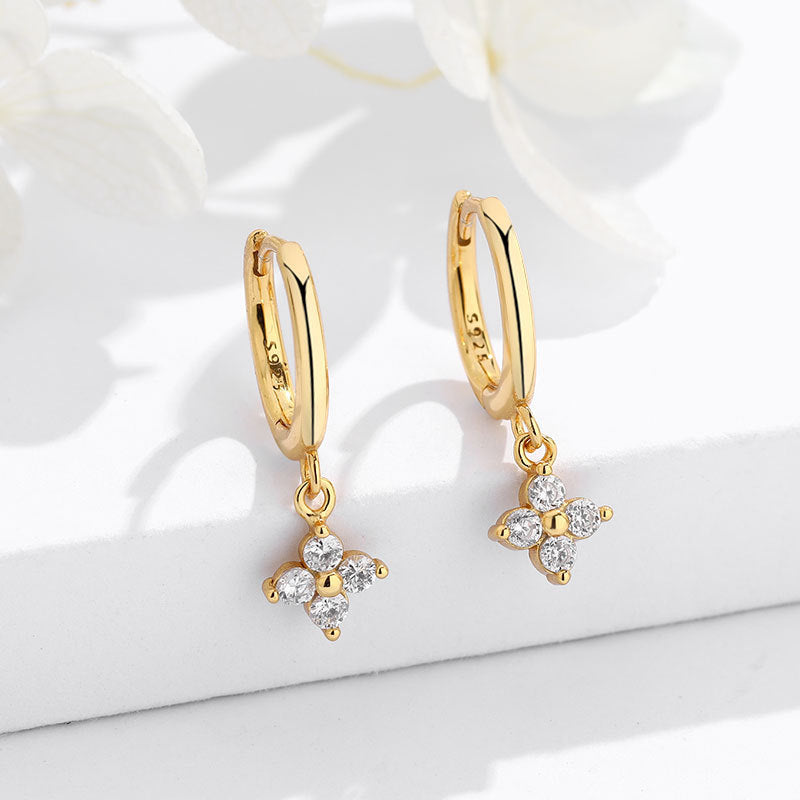 S925 silver four-leaf clover stud earrings featuring sparkling zirconia pave, available in gold and silver