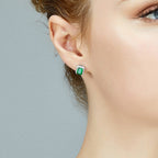 Square emerald green stud earrings with a sparkling zirconia halo pave, crafted in polished S925 sterling silver