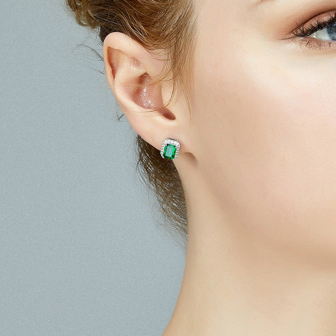 Square emerald green stud earrings with a sparkling zirconia halo pave, crafted in polished S925 sterling silver