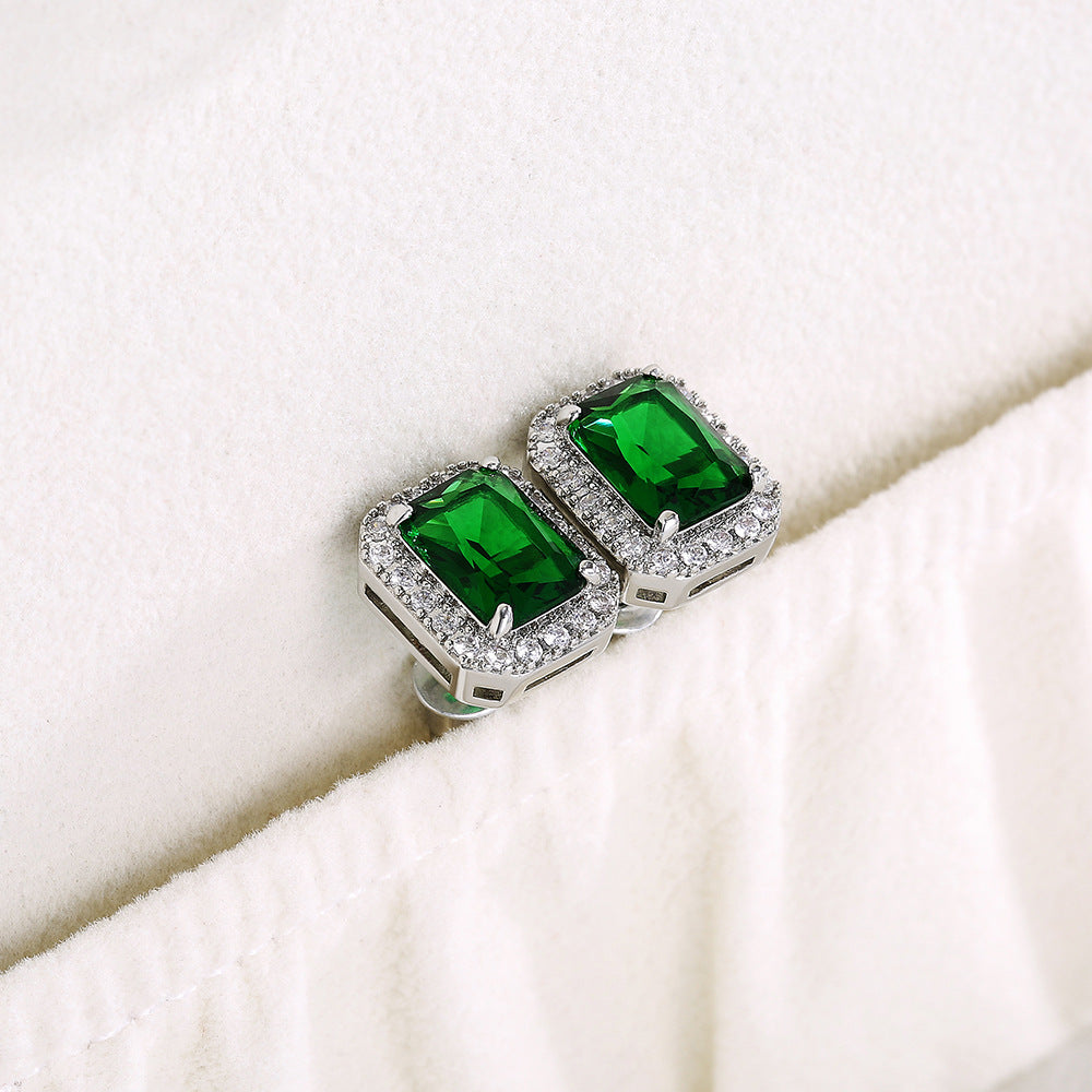 Square emerald green stud earrings with a sparkling zirconia halo pave, crafted in polished S925 sterling silver