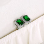 Square emerald green stud earrings with a sparkling zirconia halo pave, crafted in polished S925 sterling silver