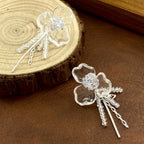 Silver S925 floral drop earrings featuring crystal-encrusted flower studs and elegant dangling tassel chains