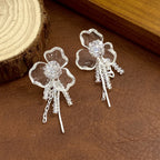 Silver S925 floral drop earrings featuring crystal-encrusted flower studs and elegant dangling tassel chains