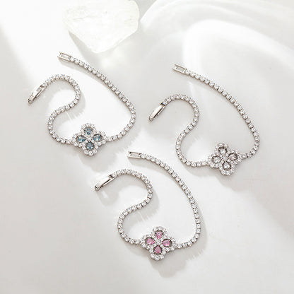S925 sterling silver tennis bracelet with a four-leaf clover halo charm featuring sparkling cubic zirconia