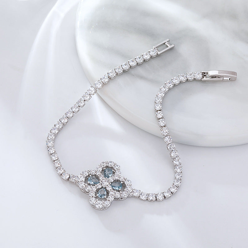 S925 sterling silver tennis bracelet with a four-leaf clover halo charm featuring sparkling cubic zirconia