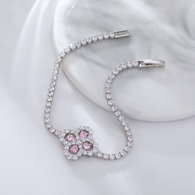 S925 sterling silver tennis bracelet with a four-leaf clover halo charm featuring sparkling cubic zirconia