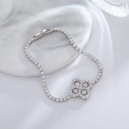 S925 sterling silver tennis bracelet with a four-leaf clover halo charm featuring sparkling cubic zirconia