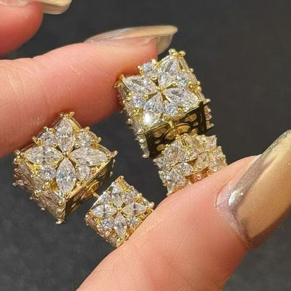 Minimalist S925 silver cube stud earrings featuring a sparkling central zirconia, available in gold and silver