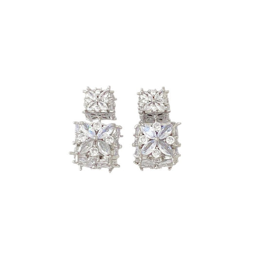 Minimalist S925 silver cube stud earrings featuring a sparkling central zirconia, available in gold and silver