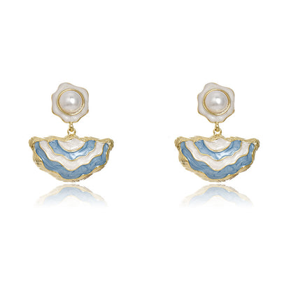 Gold S925 silver drop earrings featuring blue enamel studs and elegant dangling white pearls with a handmade finish