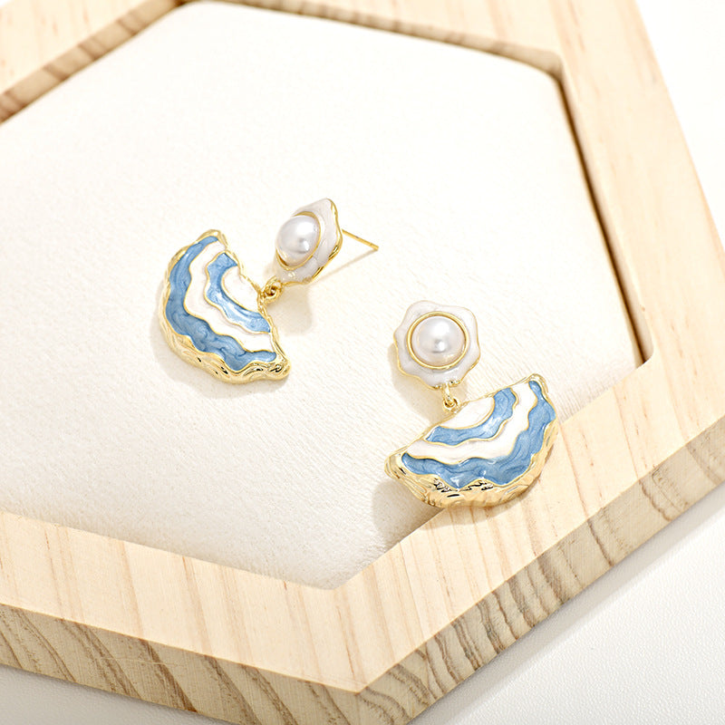 Gold S925 silver drop earrings featuring pink enamel studs and elegant dangling white pearls with a handmade finish
