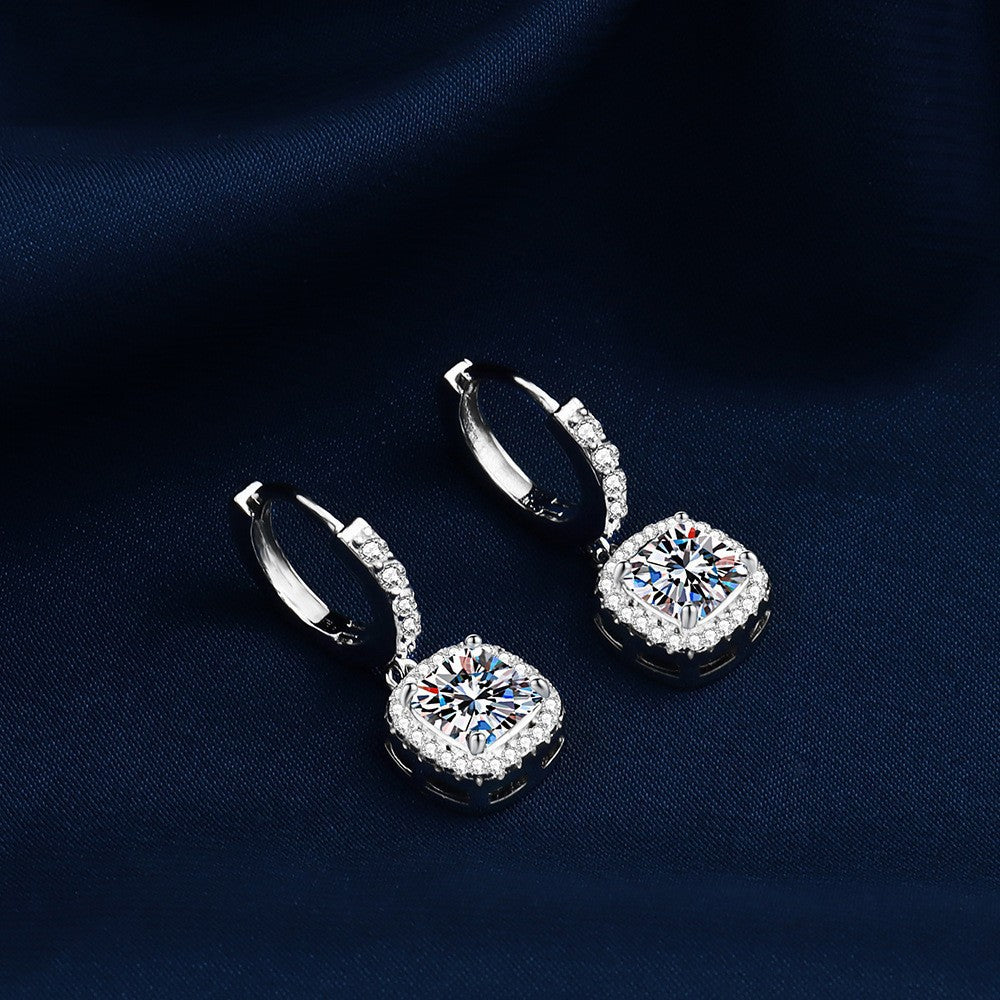 S925 sterling silver stud earrings featuring a brilliant round zirconia center with a sparkling halo pave border