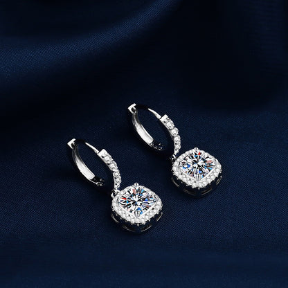 S925 sterling silver stud earrings featuring a brilliant round zirconia center with a sparkling halo pave border