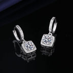 S925 sterling silver stud earrings featuring a brilliant round zirconia center with a sparkling halo pave border