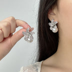 Elegant S925 sterling silver lily flower stud earrings featuring a lustrous white pearl center in a silver tone