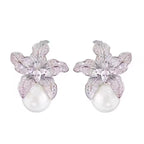 Elegant S925 sterling silver lily flower stud earrings featuring a lustrous white pearl center in a silver tone