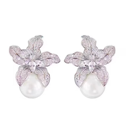Elegant S925 sterling silver lily flower stud earrings featuring a lustrous white pearl center in a silver tone