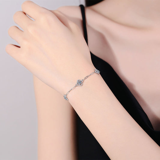 Elegant S925 sterling silver bracelet featuring a blooming flower charm set with a brilliant moissanite stone